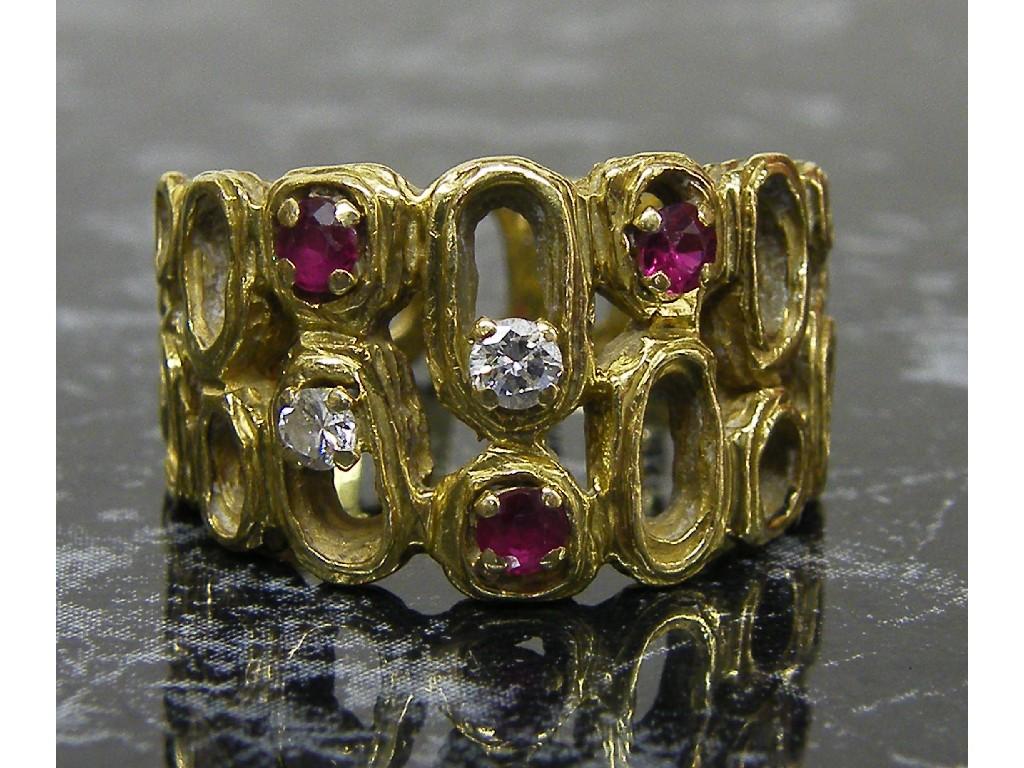 Appraisal: Gold diamond and ruby set pierced ring size M