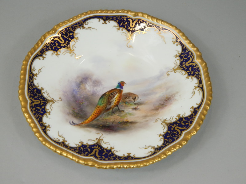 Appraisal: A Royal Worcester cabinet plate painted centrally with a cock