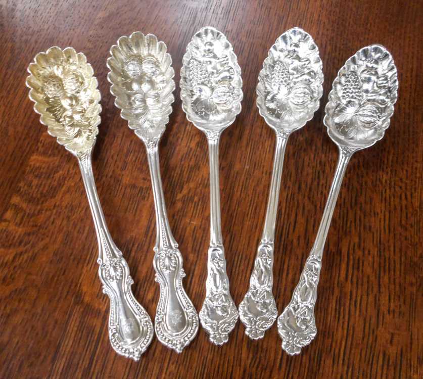 Appraisal: FIVE SILVER BERRY SERVING SPOONS set of Victorian British sterling