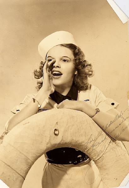 Appraisal: A Judy Garland signed sepia photograph circa A vintage print