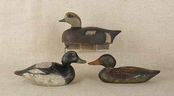 Appraisal: Three carved and painted duck decoys th c longest -