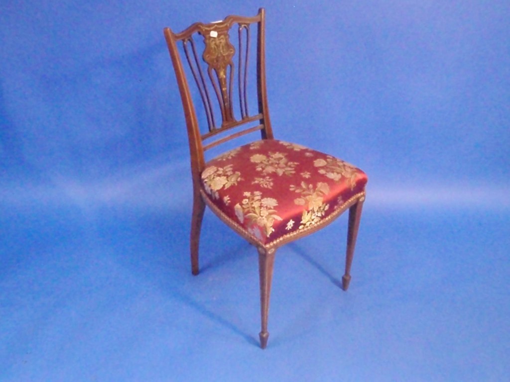 Appraisal: An Edwardian rosewood marquetry bedroom chair with pierced splat back