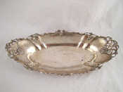 Appraisal: A long oval silver dish with pierced and applied decoration