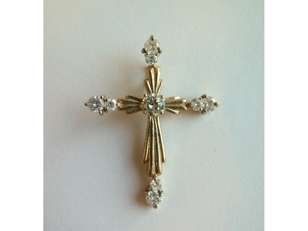 Appraisal: Nine carat gold diamond set cross pendant with point central