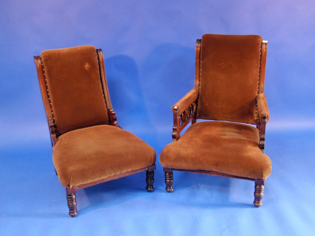 Appraisal: A pair of late Victorian ladies and gents upholstered chairs