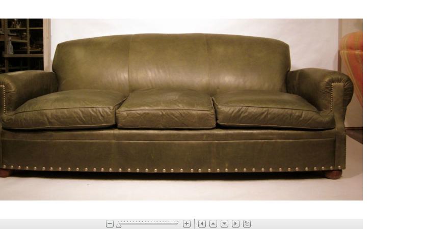 Appraisal: Gray leather three seat sofaThe shaped overstuffed back issuing two