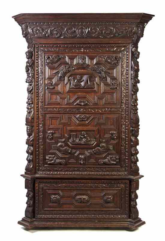 Appraisal: A Renaissance Revival Carved Oak Armoire having a projecting ogee