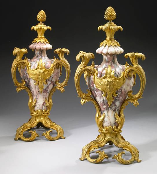 Appraisal: A pair of Belle Epoque gilt bronze mounted marble urns