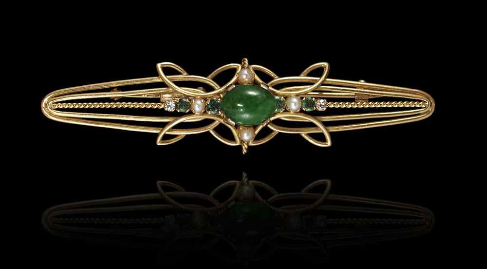 Appraisal: K JADE EMERALD AND DIAMOND BROOCH K yellow gold brooch