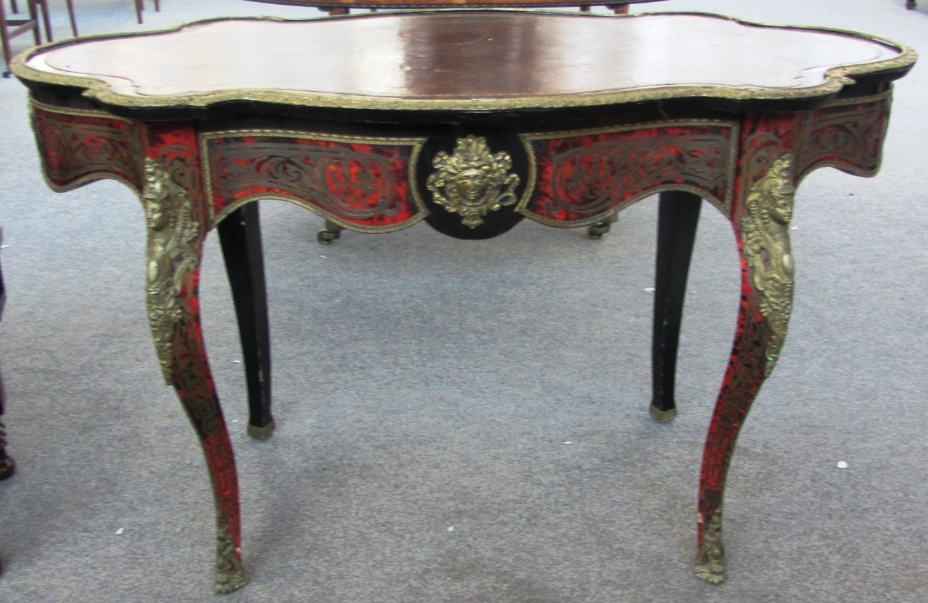 Appraisal: A th century ebonised gilt metal mounted boulle work shaped