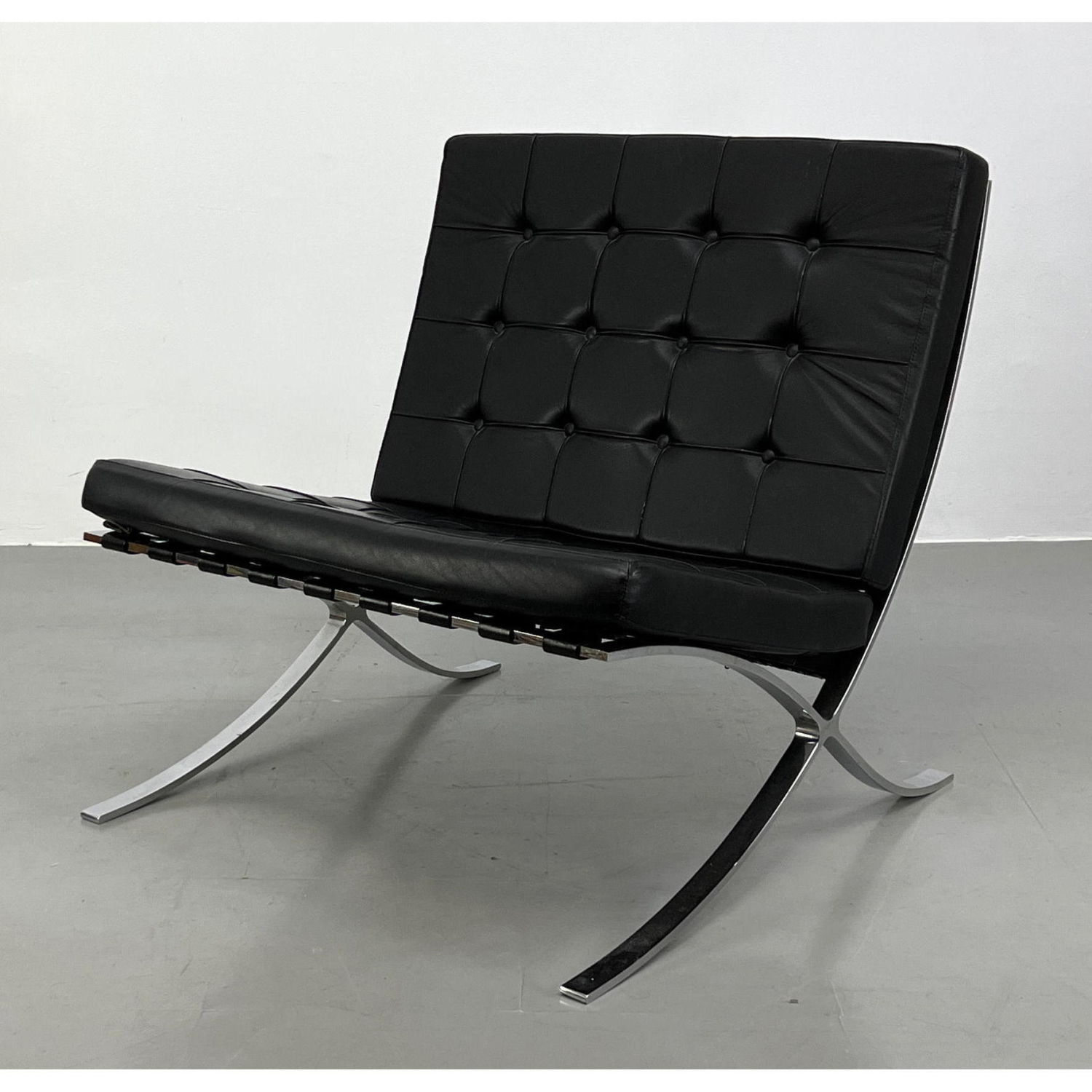 Appraisal: Barcelona Style lounge chair in black leather Unmarked Dimensions H