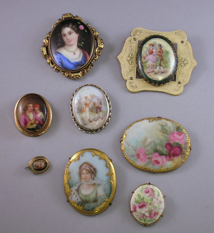 Appraisal: Eight Painted Porcelain Brooches including portraits genre scenes and flowers