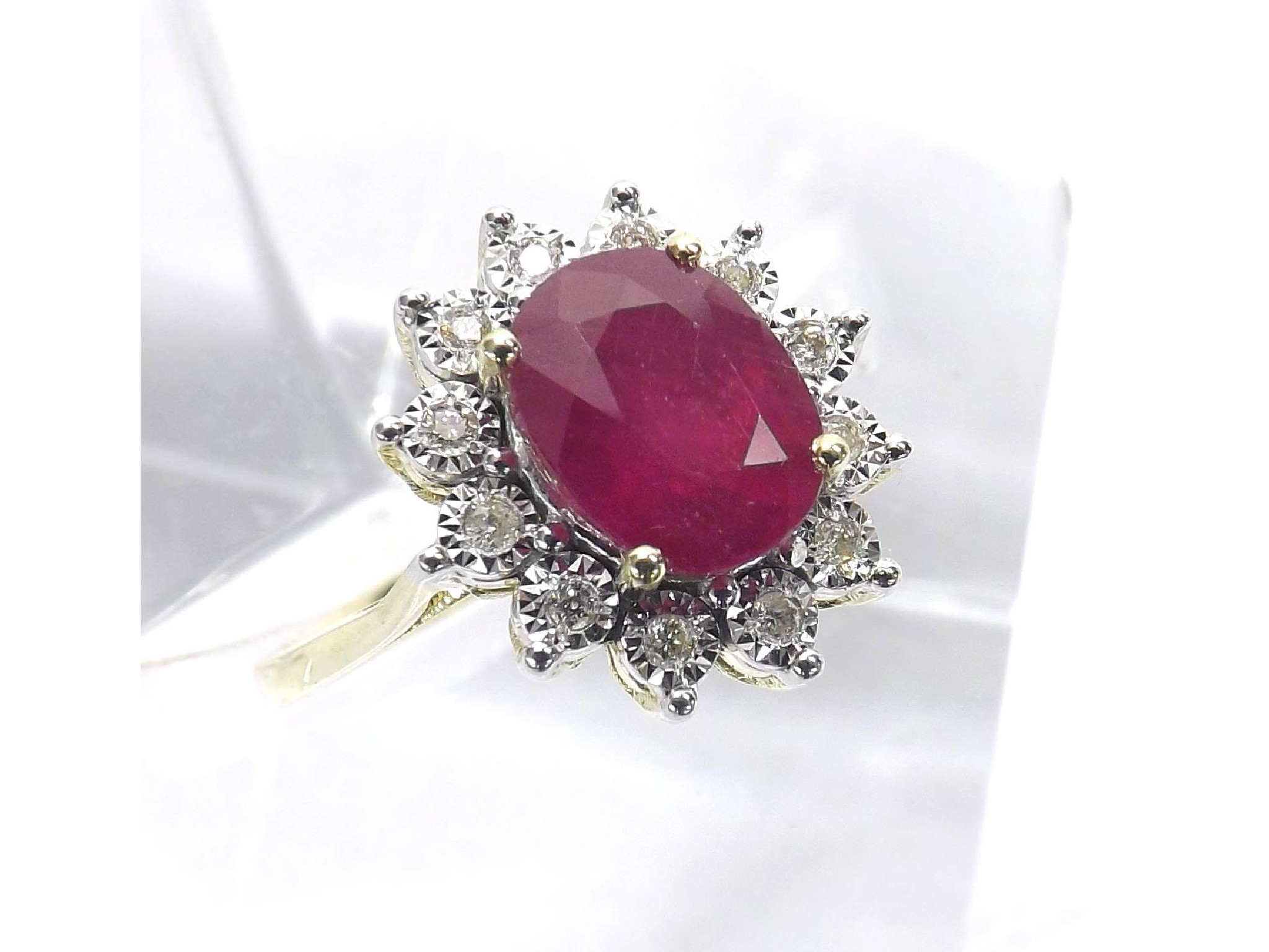 Appraisal: Ruby and diamond oval cluster ring the oval ruby in