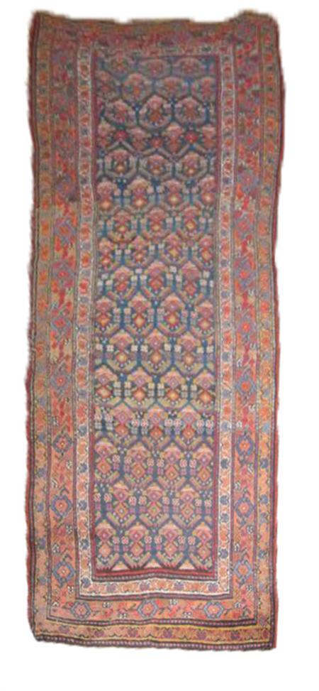 Appraisal: A North West Persian long rug the blue field with