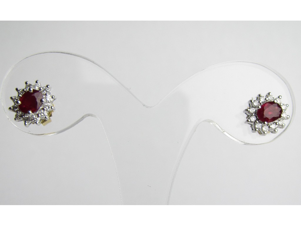 Appraisal: Pair of eighteen carat gold ruby and diamond cluster stud