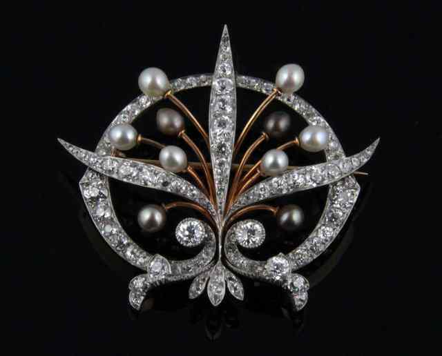 Appraisal: A diamond and pearl brooch modelled as three diamond set