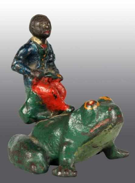 Appraisal: Cast Iron Black Boy on Frog Doorstop Description Full-figure solid