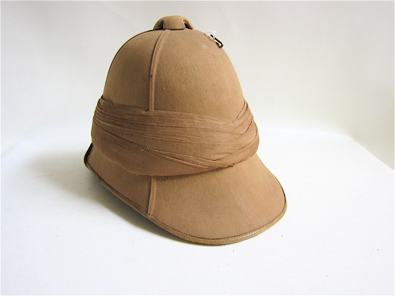 Appraisal: ENGLISH FOREIGN SERVICE HELMET pattern khaki color cloth covered vent