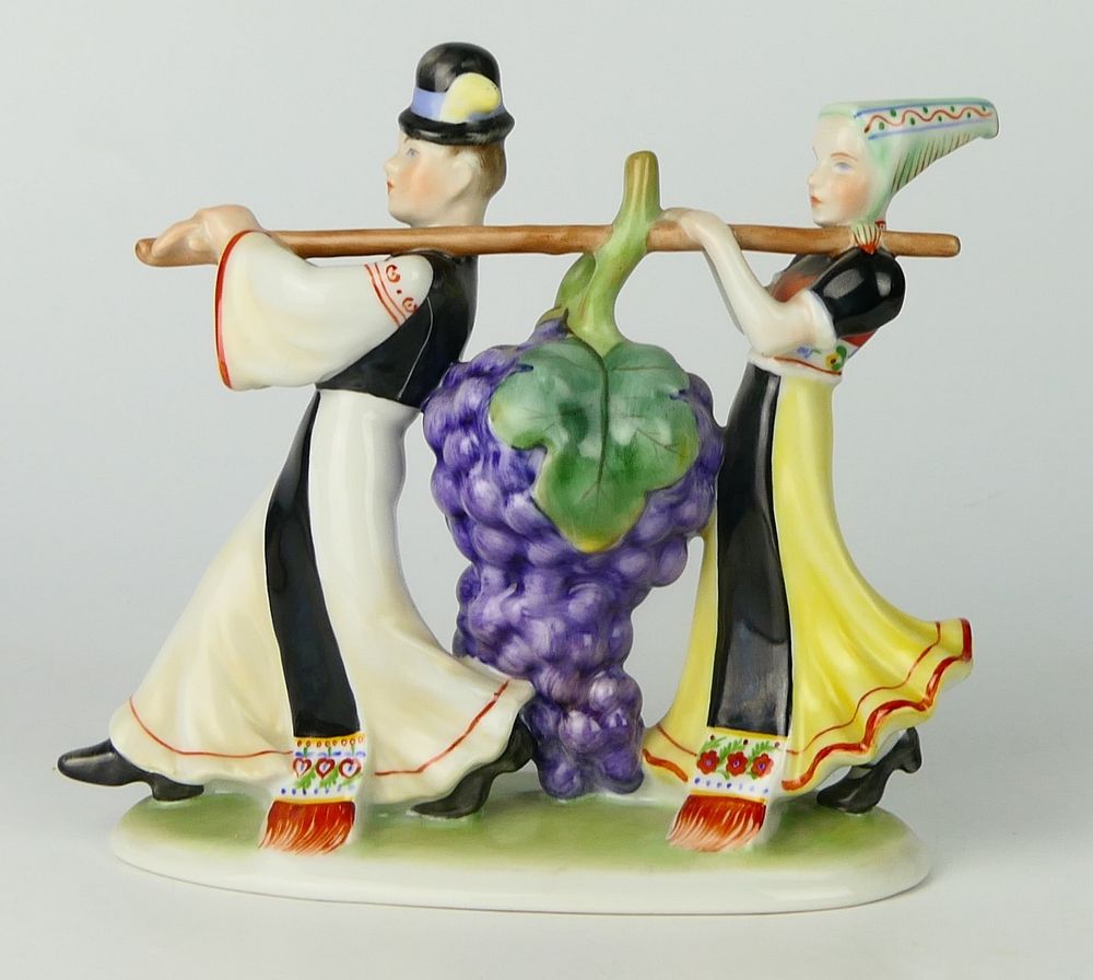 Appraisal: HEREND HUNGARIAN FIGURINE HARVESTING GRAPES Man and woman in folk