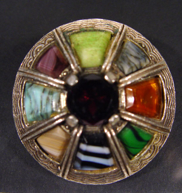 Appraisal: Miracle Celtic design brooch with coloured stone