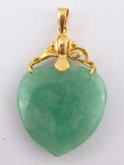 Appraisal: A jade heart pendant with yellow metal tests carat gold