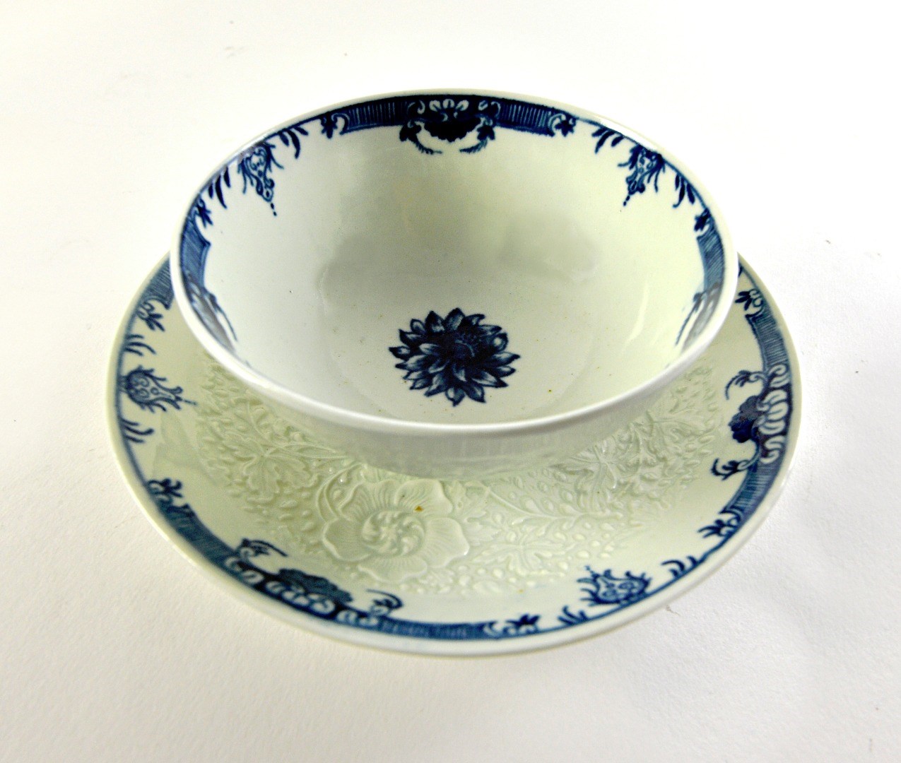 Appraisal: A large Worcester blue and white moulded teabowl and saucer