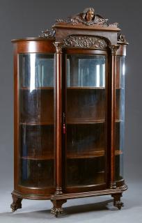 Appraisal: American Carved Oak Curved Glass Curio Cabinet la American Carved