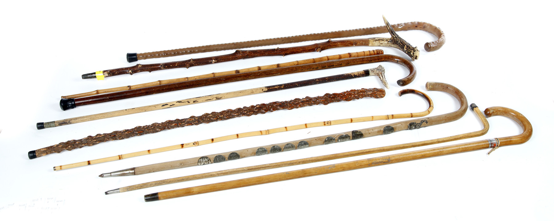 Appraisal: TEN CANES AND WALKING STICKS Twentieth century Including two with