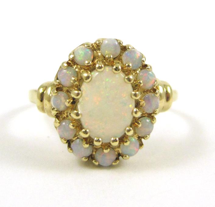 Appraisal: OPAL AND TEN KARAT YELLOW GOLD RING with twelve round