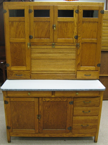 Appraisal: AN OAK HOOSIER KITCHEN CABINET American early th century in