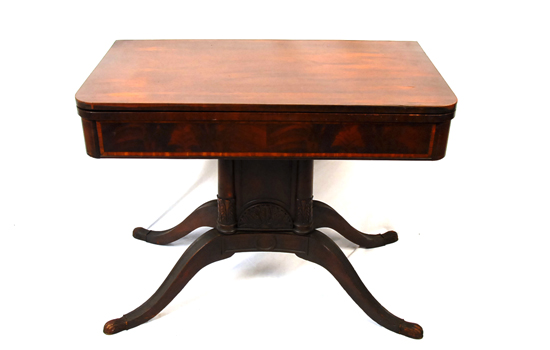 Appraisal: A Mahogany Colonial Revival Folding Top Table with cross banding