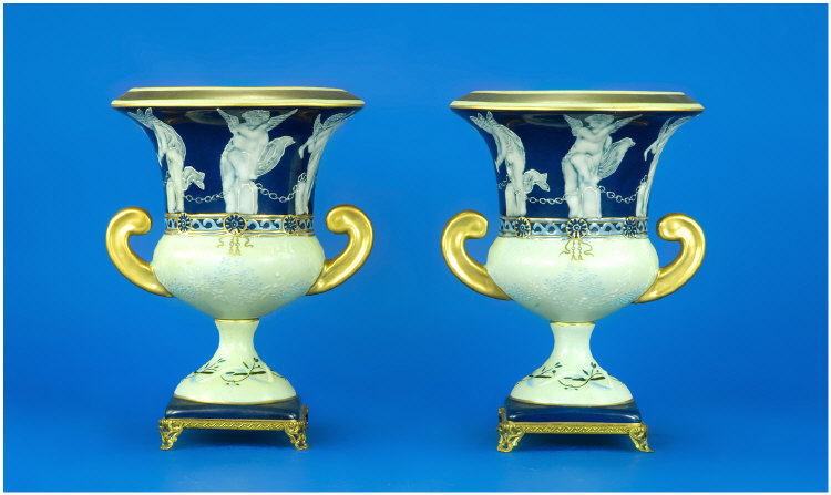 Appraisal: Pair of Campagna Two Handled Urns With a Frieze of