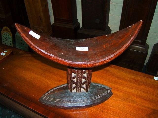 Appraisal: An antique African tribal stool or neck rest with decoratively