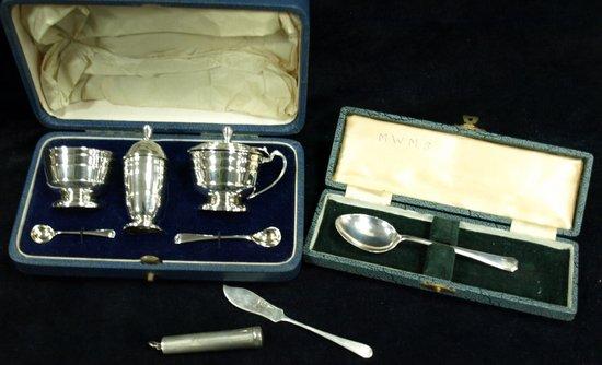 Appraisal: A cased cruet set of stepped form Adie Brothers Birmingham