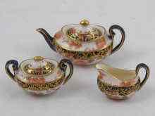 Appraisal: A Royal Crown Derby miniature china teapot lidded sugar bowl