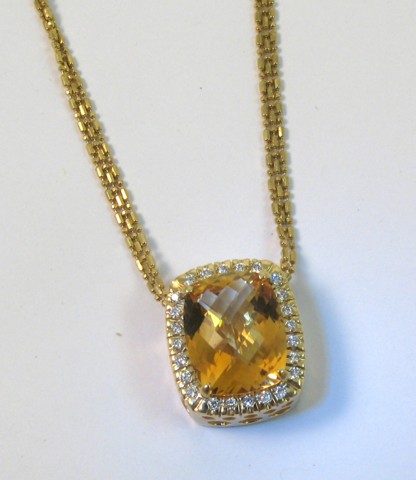 Appraisal: CITRINE AND DIAMOND PENDANT NECKLACE the pendant centering a cushion