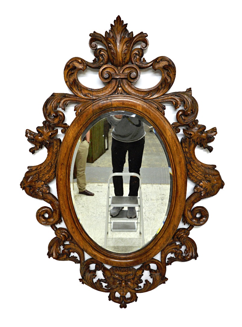 Appraisal: A th century carved beech wall mirror the frame profusely