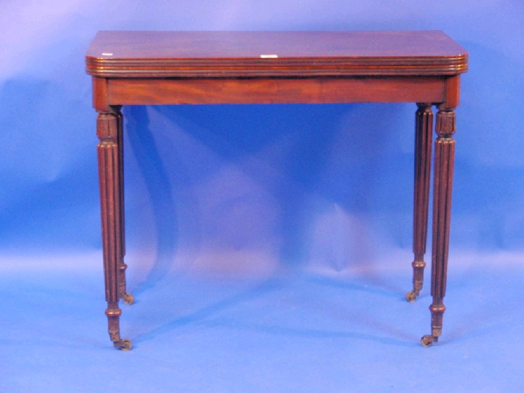 Appraisal: A George IV mahogany card table with rounded rectangular folding