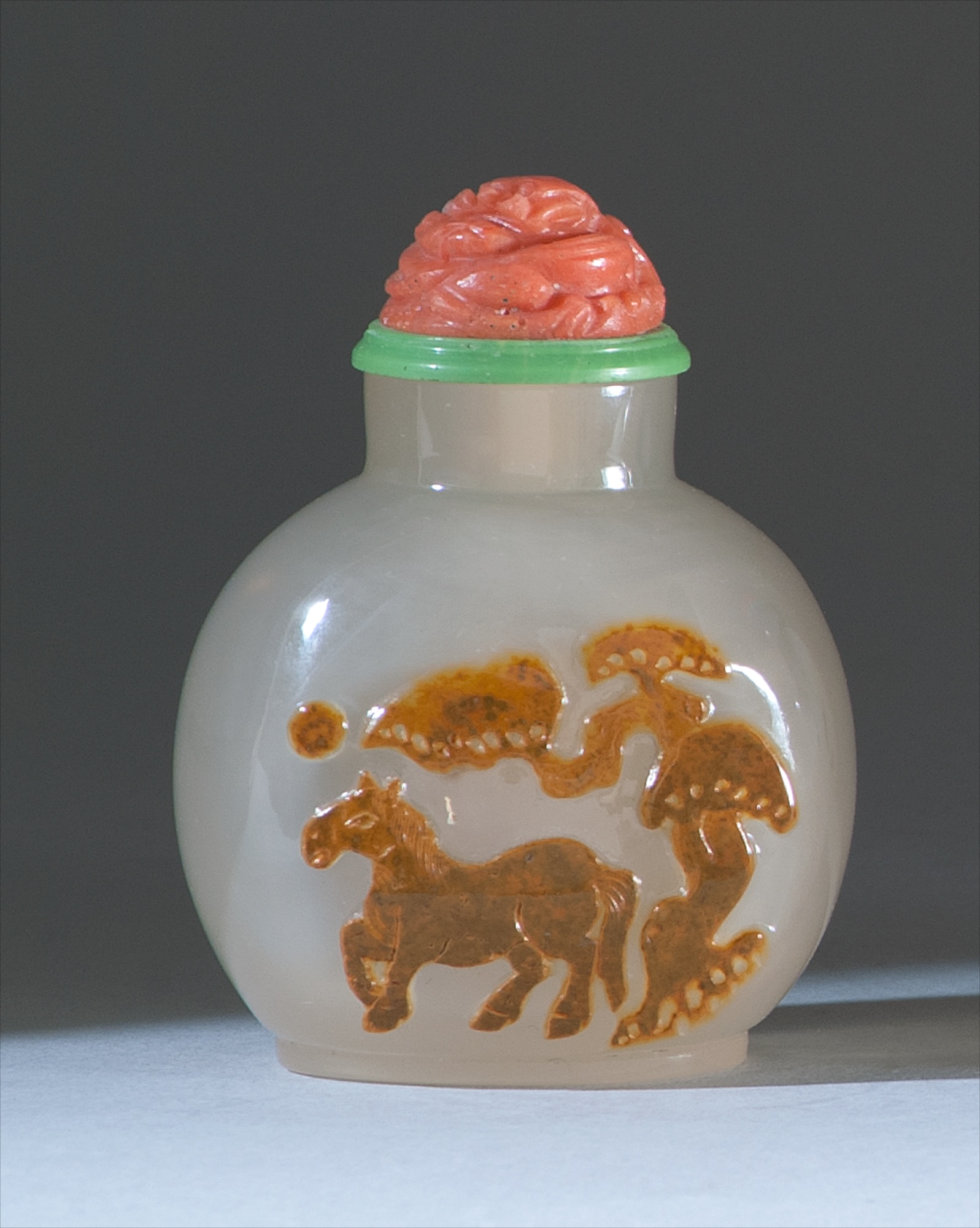 Appraisal: CHALCEDONY AGATE SNUFF BOTTLE In ovoid form with cameo design