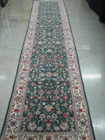 Appraisal: An oriental rug runner traditional design green ' wide