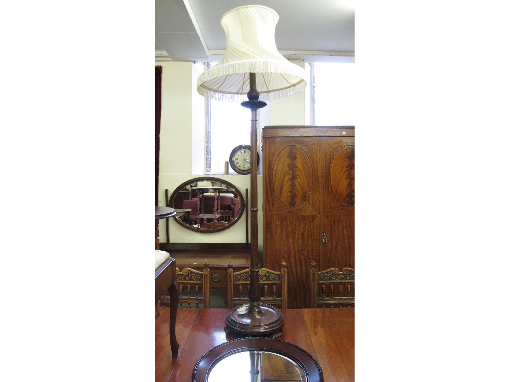 Appraisal: Mahogany floor lamp with shade and a circular wall mirror