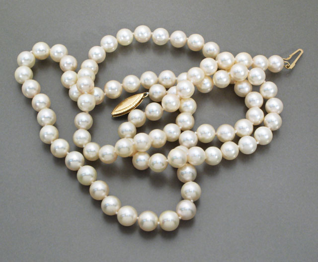 Appraisal: OPERA LENGTH PEARL NECKLACE strung with round white pearls -