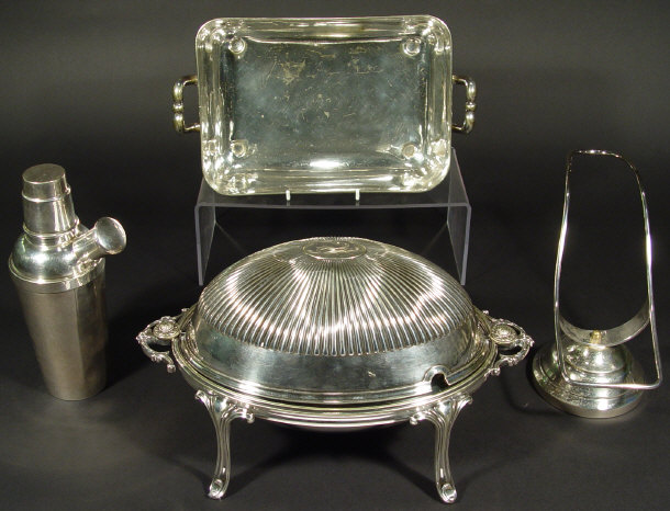 Appraisal: Four silver plated items comprised an oval breakfast dish with