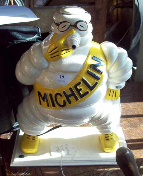 Appraisal: A CAST METAL MICHELIN MAN COMPRESSOR