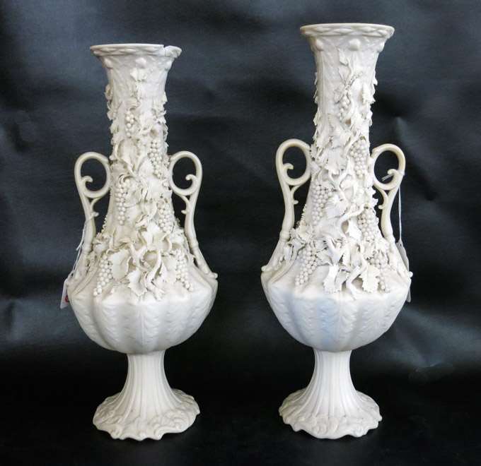 Appraisal: PAIR OF PARIAN CLASSICAL SPLIT-HANDLE VASES with applied grapevine detail