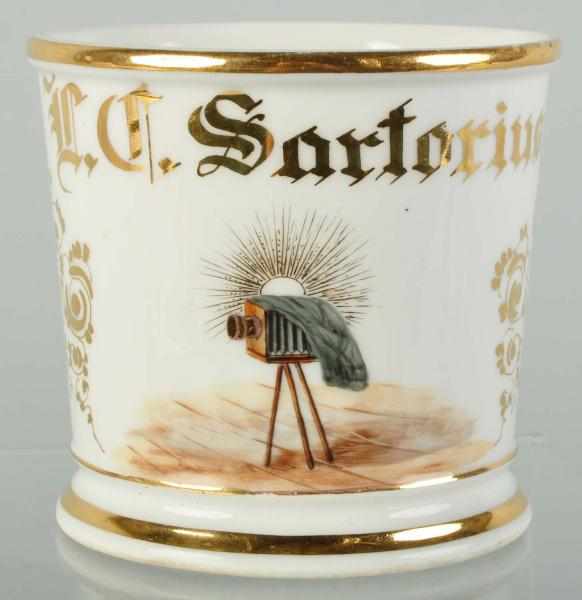 Appraisal: Stationary Camera on Tripod Shaving Mug Description Gilt name L