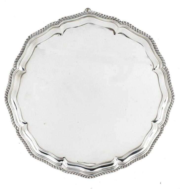 Appraisal: A VICTORIAN SALVER with gadrooned rim on three hoof feet