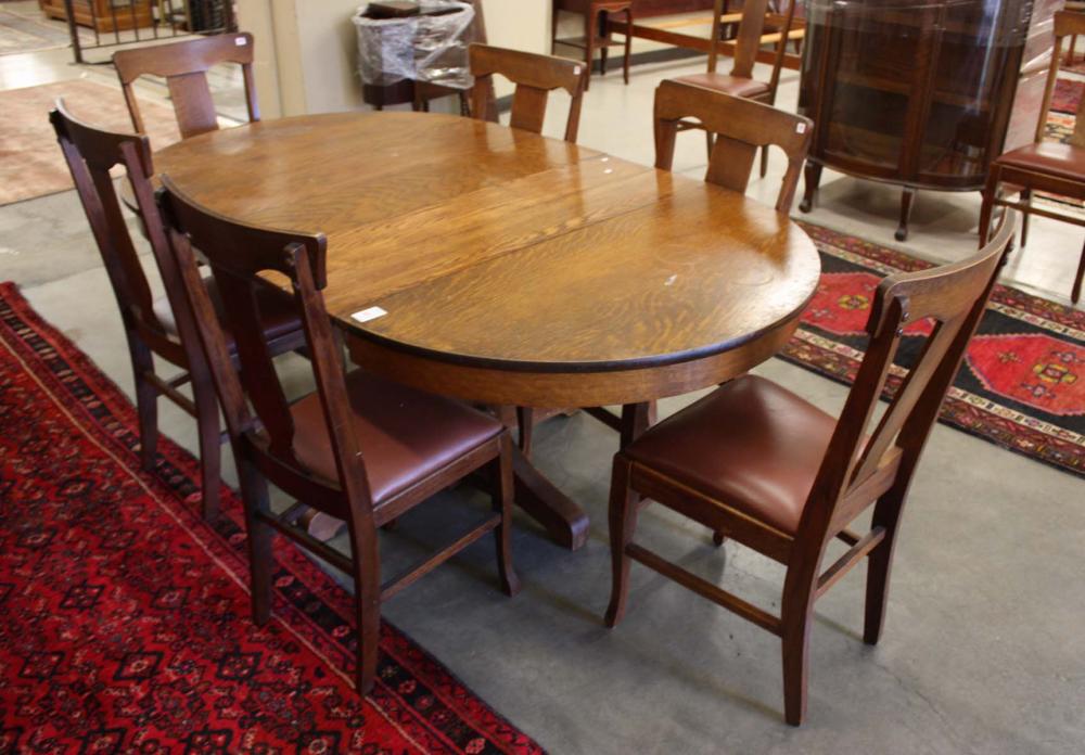 Appraisal: ROUND OAK PEDESTAL DINING TABLE SIX LEAVES AND EIGHT CHAIRS