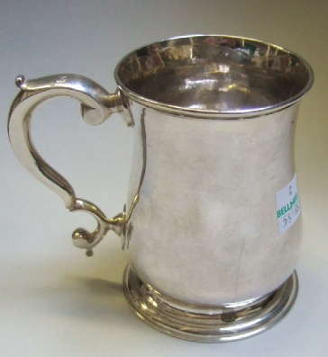 Appraisal: A George II silver baluster shaped mug with a scrolling