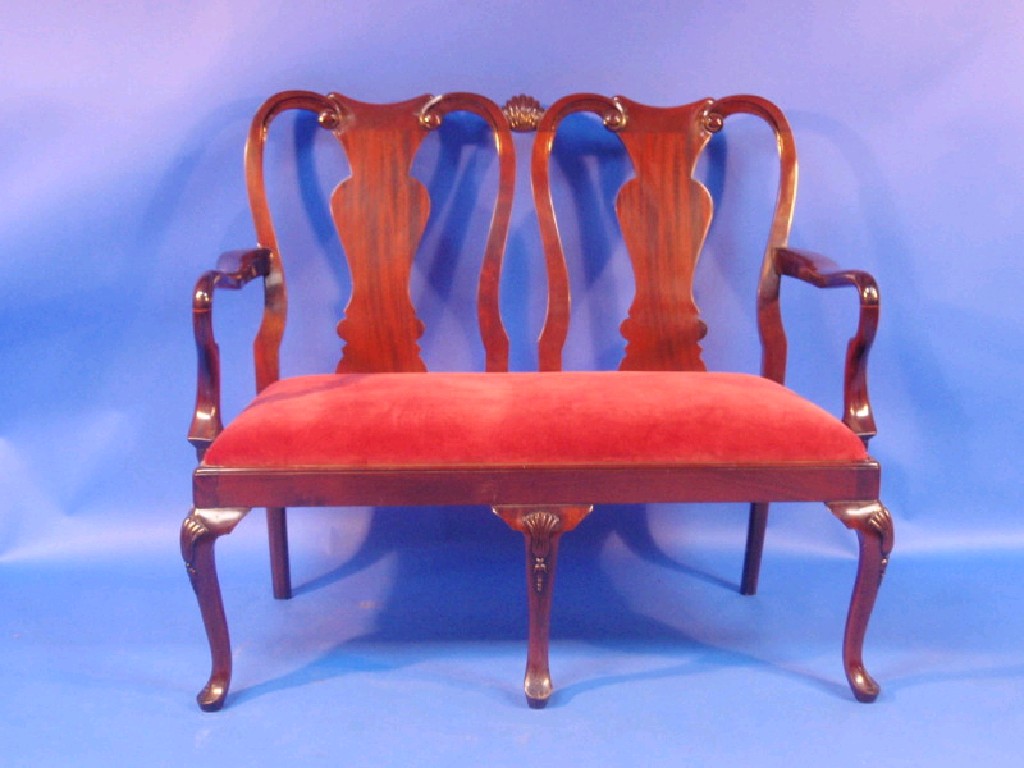 Appraisal: A reproduction George I mahogany two seater settee with solid